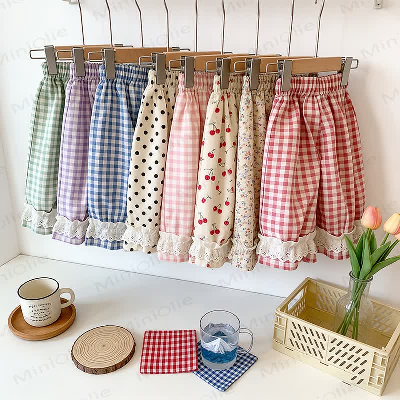 Pantaloni da casa per bambina a quadretti con orlo in pizzo - image 1