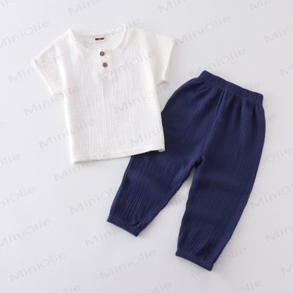 Completo per bambino composto da top e pantaloni in tinta unita con bottoni sul davanti, colore cotone. - Bianco e blu navy - 6-7T - image 4