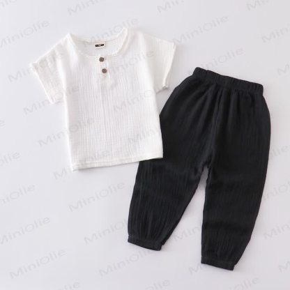 Completo per bambino composto da top e pantaloni in tinta unita con bottoni sul davanti, colore cotone. - Bianco e nero - 6-7T - image 5