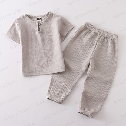 Completo per bambino composto da top e pantaloni in tinta unita con bottoni sul davanti, colore cotone. - Grigio - 6-7T - image 12