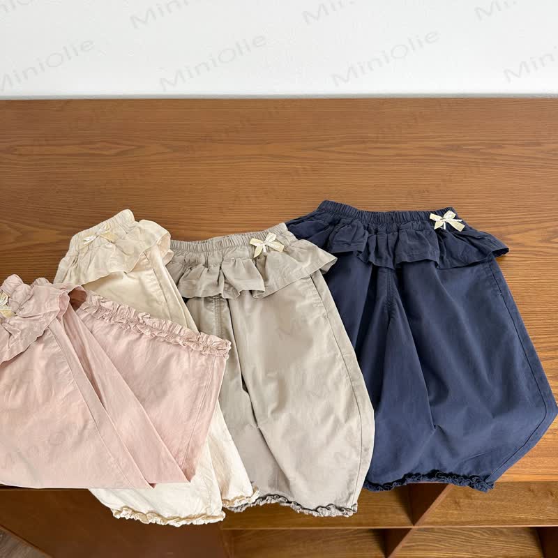 Pantaloni a tinta unita con volant in vita per bambina - image 1