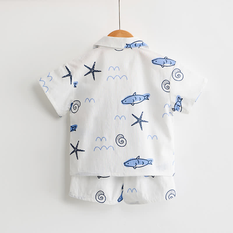 Completo da bambino composto da maglietta e pantaloncini bianchi con stampa di pesci. - image 3