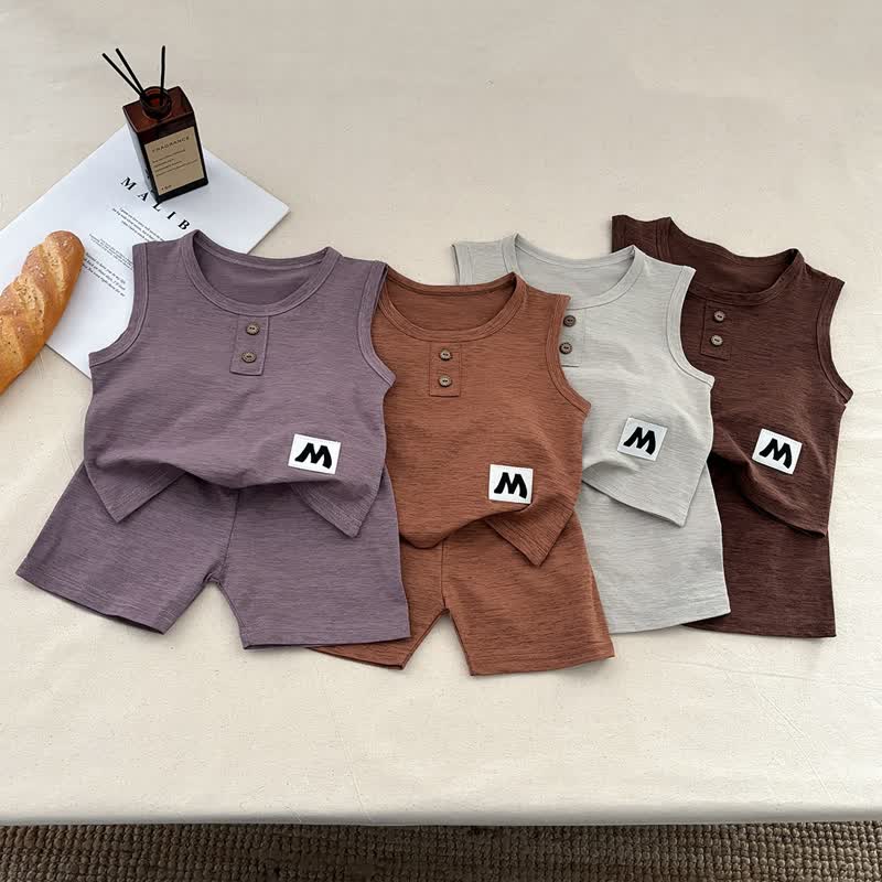 Completo pigiama da 2 pezzi per neonati e bambini piccoli, composto da canotta e pantaloncini in tinta unita. - image 1