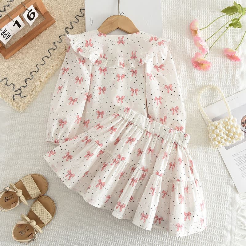 Completo da bambina composto da top e gonna bianchi e rosa con fiocco. - image 2