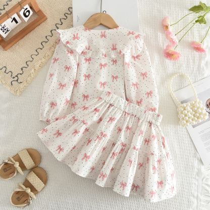 Completo da bambina composto da top e gonna bianchi e rosa con fiocco. - image 2