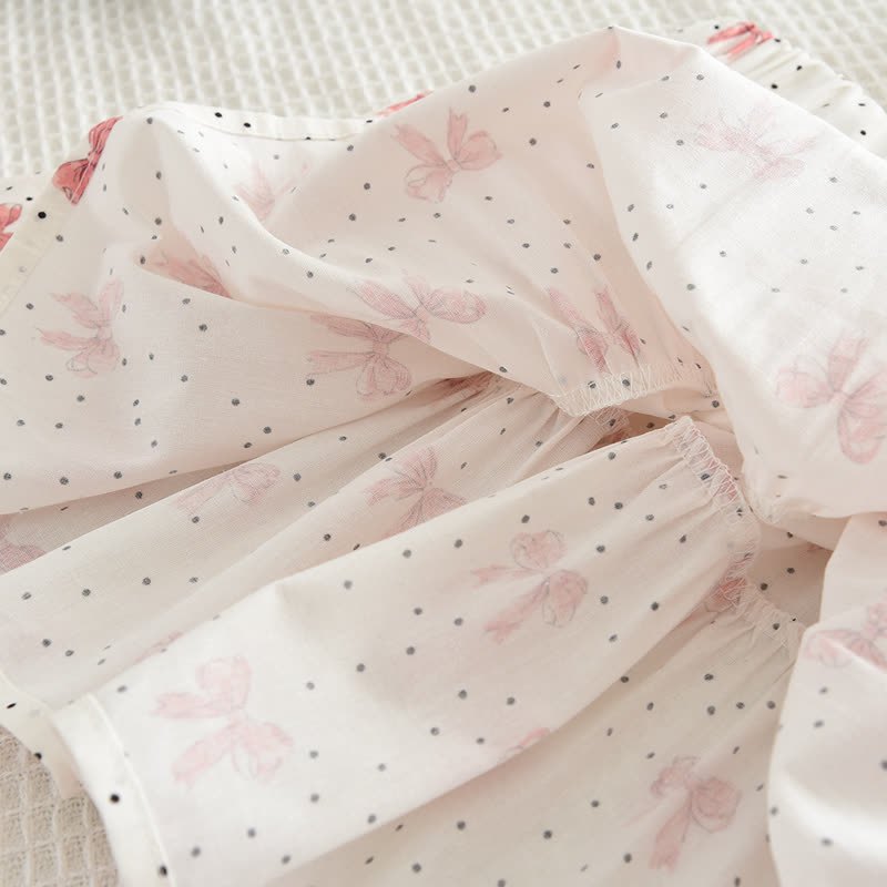 Completo da bambina composto da top e gonna bianchi e rosa con fiocco. - image 10