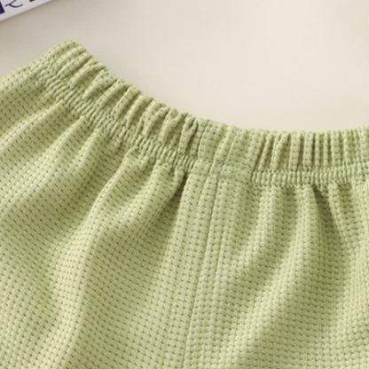 Completo per bambini composto da top a nido d'ape in tinta unita con tasche e pantaloncini. - image 13