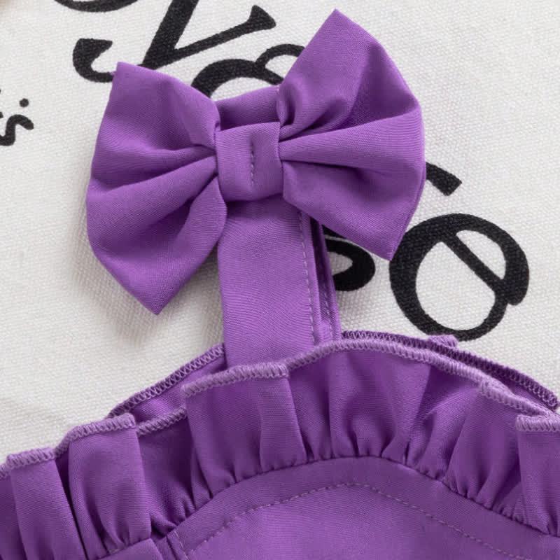 Completo da bambina composto da top senza maniche viola con fiocco e fiori e pantaloncini in denim. - image 3
