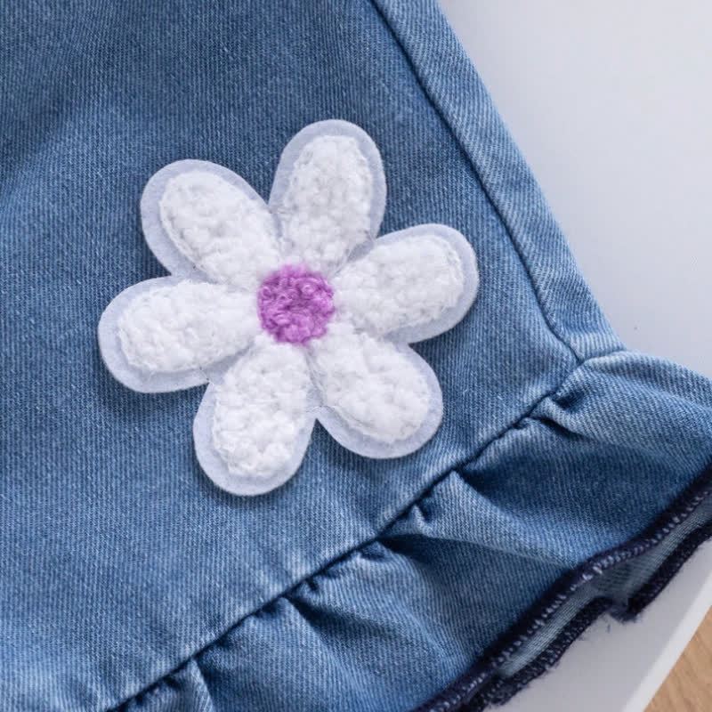 Completo da bambina composto da top senza maniche viola con fiocco e fiori e pantaloncini in denim. - image 5