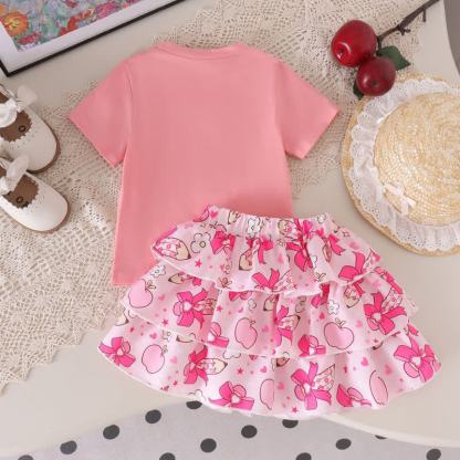 Completo da bambina composto da maglietta con applicazione di mela e gonna a balze rosa. - image 4