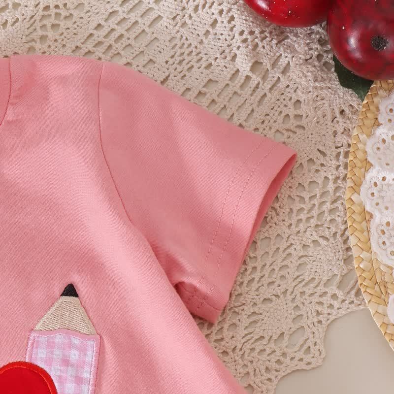 Completo da bambina composto da maglietta con applicazione di mela e gonna a balze rosa. - image 6