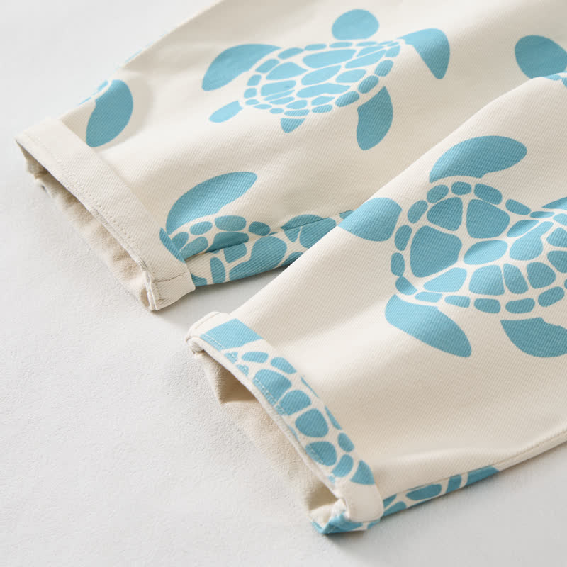Tutina beige da neonato con tartaruga marina - image 6