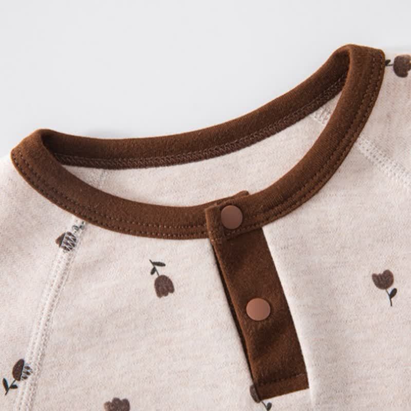Set pigiama per neonato/a composto da maglia a maniche lunghe e pantaloni con stampa animalier/piante. - image 8