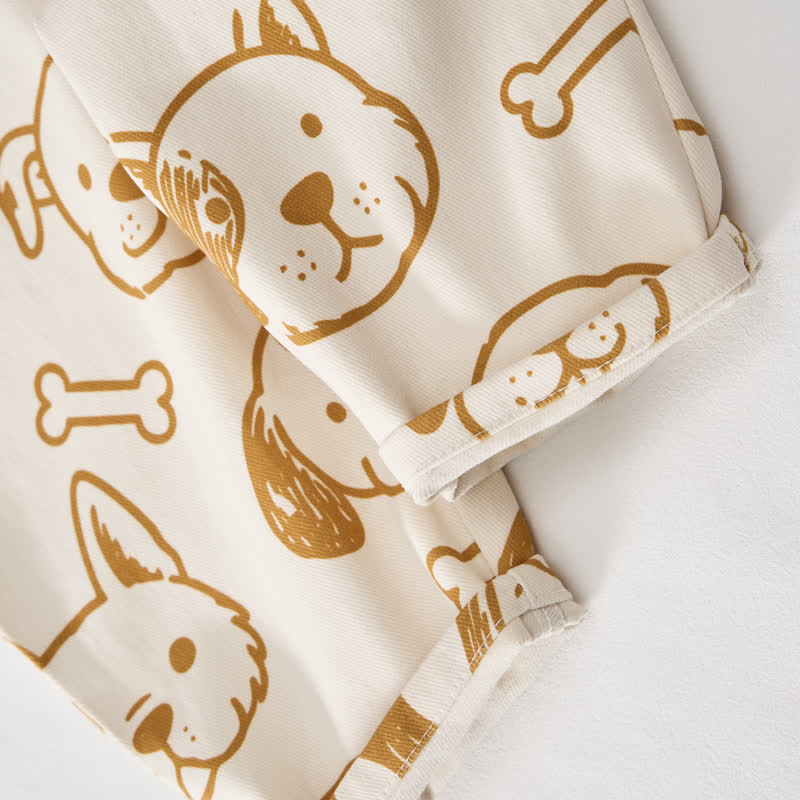 Salopette per neonati e bambini piccoli con tasca a forma di cane bianco e osso. - image 6