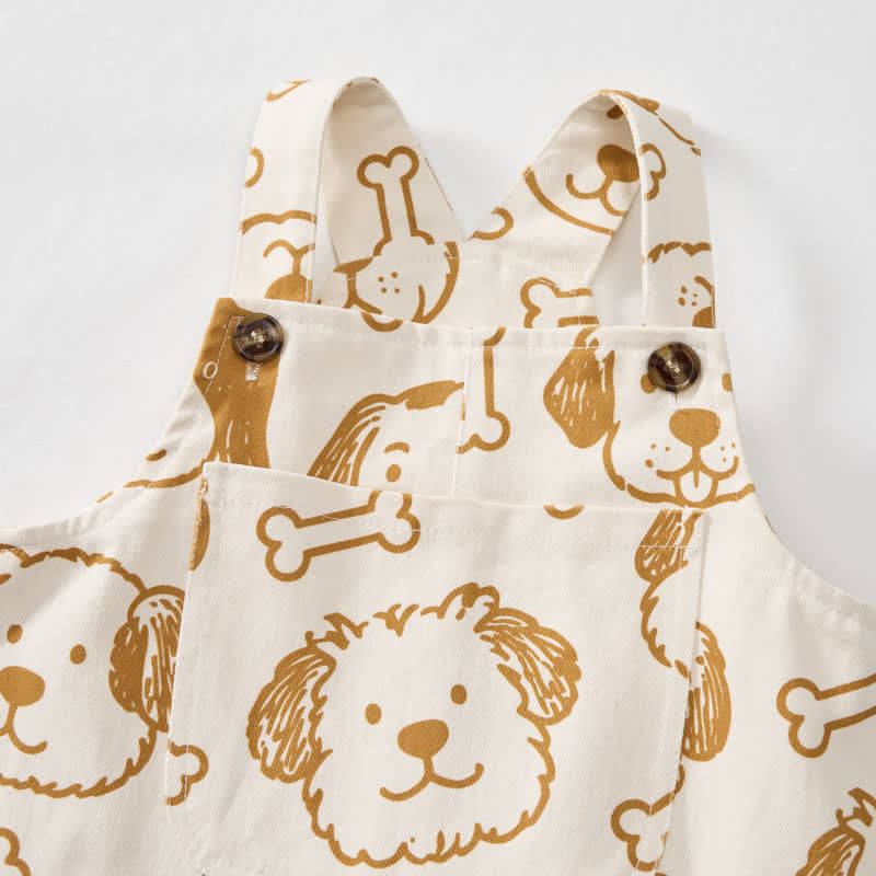 Salopette per neonati e bambini piccoli con tasca a forma di cane bianco e osso. - image 4
