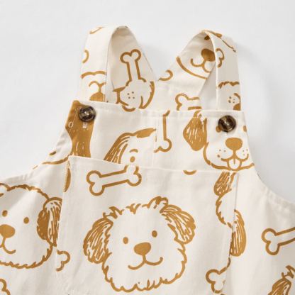 Salopette per neonati e bambini piccoli con tasca a forma di cane bianco e osso. - image 4