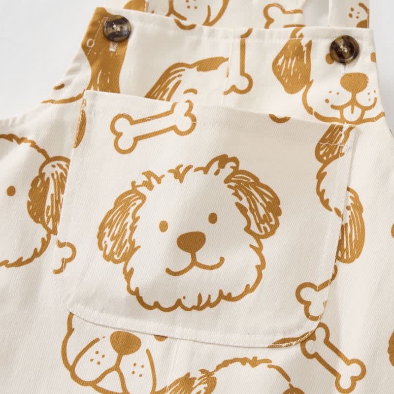 Salopette per neonati e bambini piccoli con tasca a forma di cane bianco e osso. - image 5