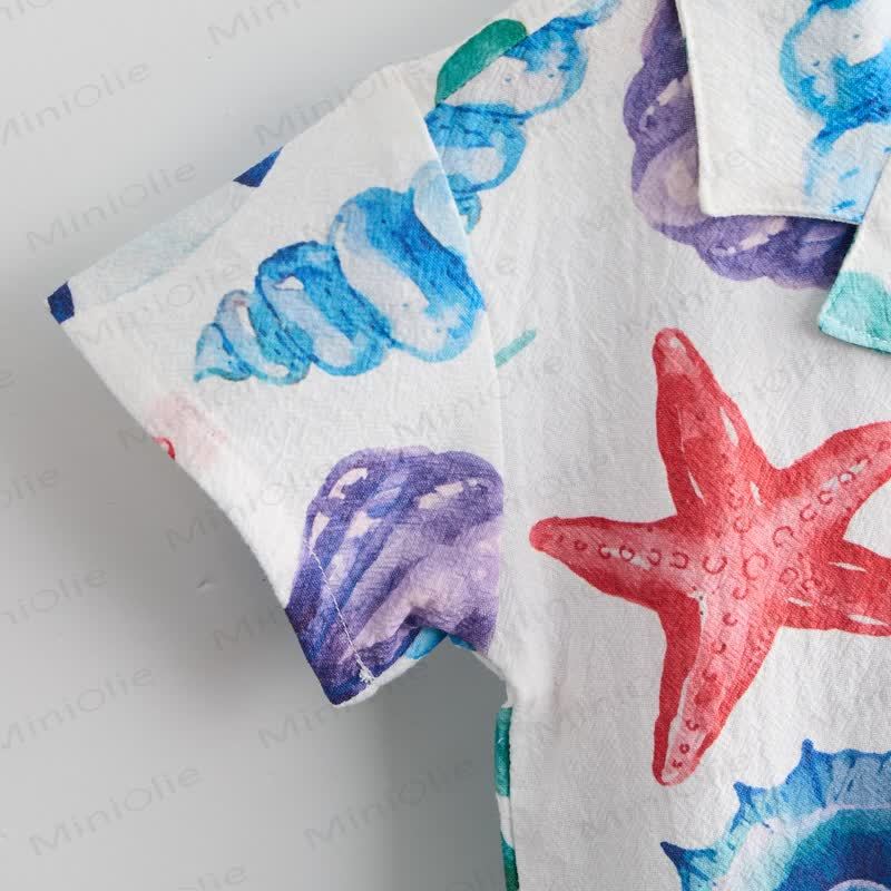 Completo da bambino composto da maglietta e pantaloncini bianchi con conchiglie e stelle marine. - image 5