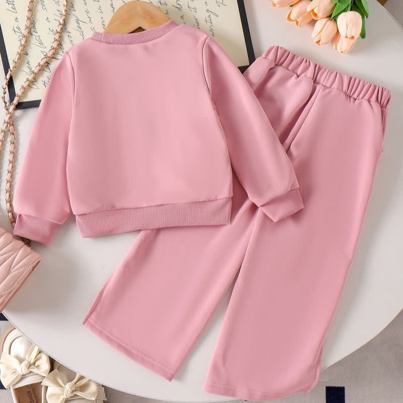 Completo da bambina composto da felpa e pantaloni rosa con fiocco in pizzo. - image 2