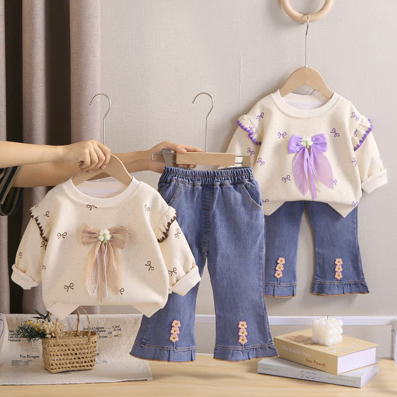 Completo da bambina composto da top in tulle con fiocco e jeans. - image 1