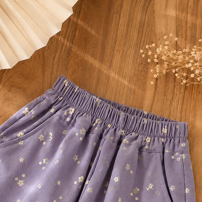 Pantaloni viola con orlo in pizzo floreale per bambina - image 3