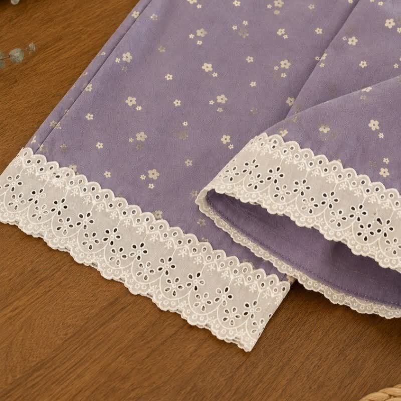 Pantaloni viola con orlo in pizzo floreale per bambina - image 4