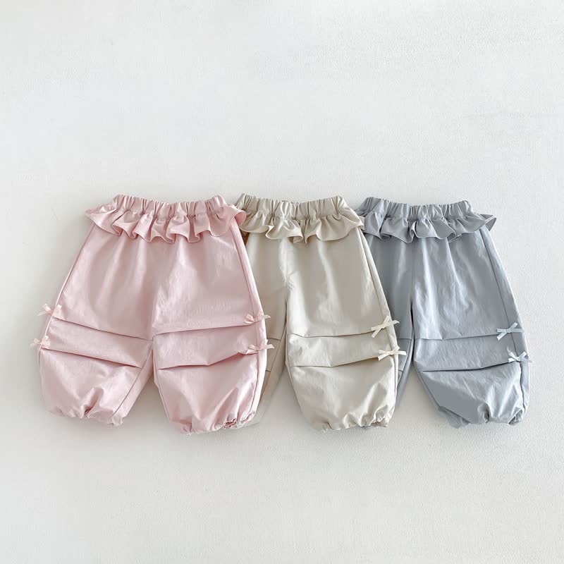 Pantaloni morbidi con fiocco e volant per bambina - image 1