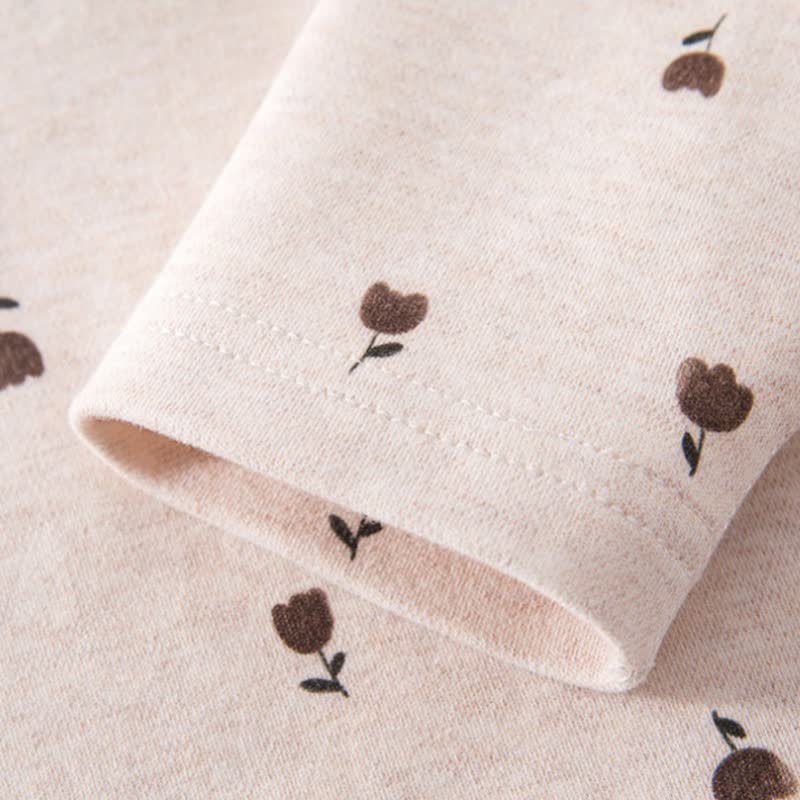 Set pigiama per neonato/a composto da maglia a maniche lunghe e pantaloni con stampa animalier/piante. - image 11