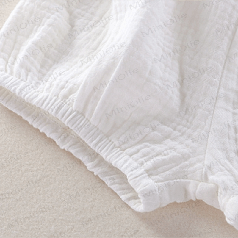 Completo da bambina in due pezzi, tinta unita, senza maniche, in garza. - image 9