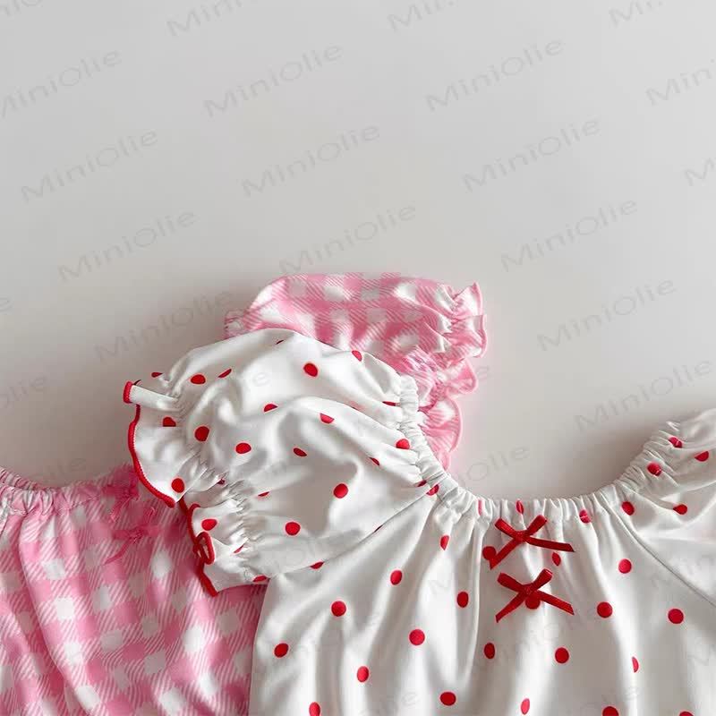 Completo da bagno a due pezzi per bambina con stampa a pois e volant, completo di cuffia da nuoto. - image 4