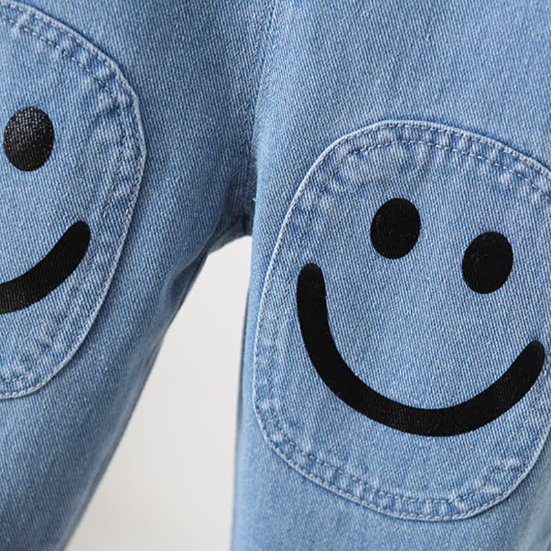 Salopette in denim con tasca e smiley per bambini - image 5