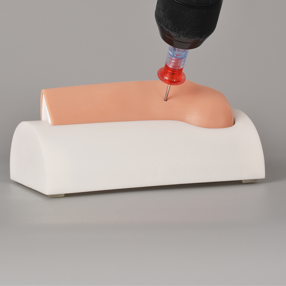 Simulated IO access procedure performed on tibial trainer for medical practice