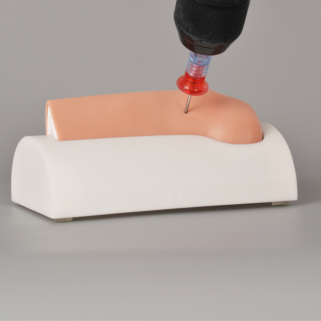 Simulated IO access procedure performed on tibial trainer for medical practice