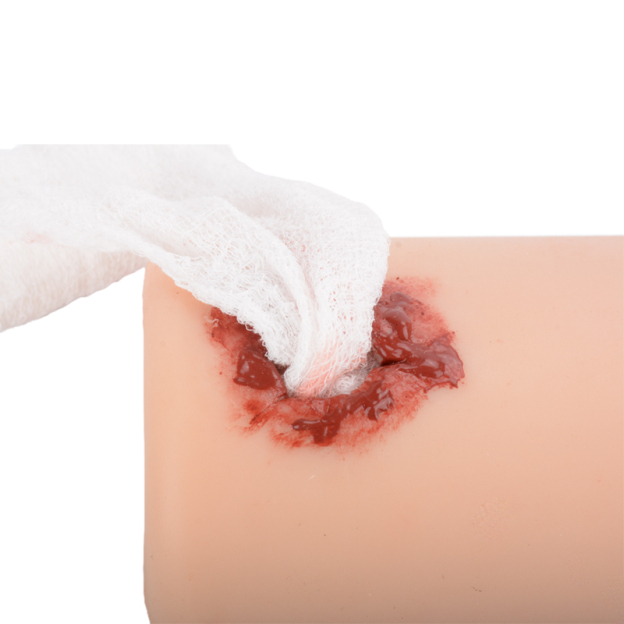 Practicing Wound Packing on Gunshot Injury Trainer