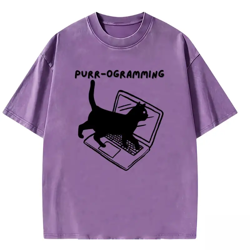 Lightweight PURR-OGRAMMING washed t-shirt in soft fabric, featuring a playful cat graphic for casual, stylish wear.