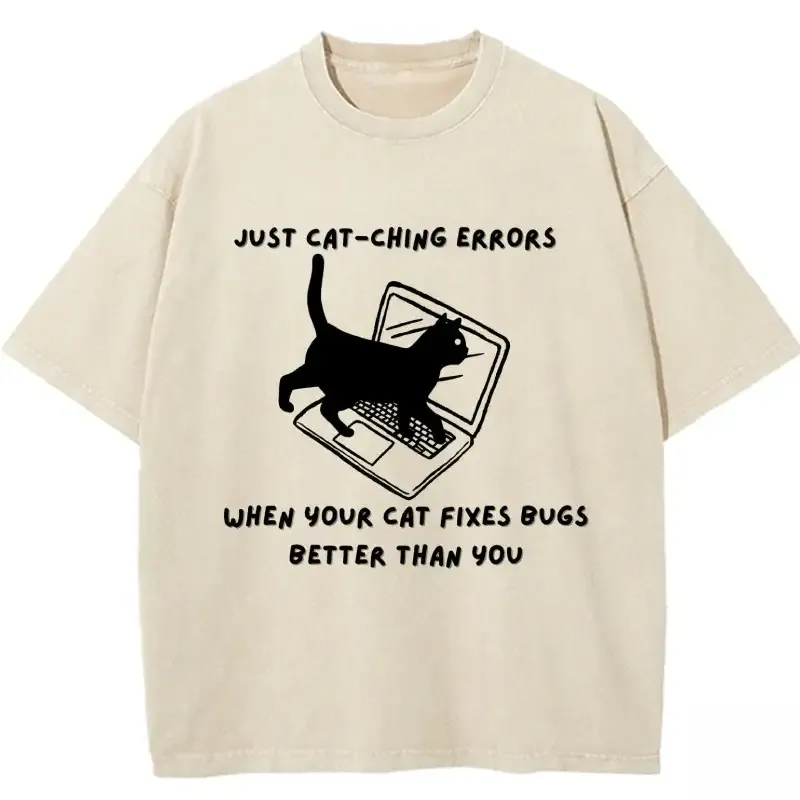 Humorous washed T-shirt featuring "When Your Cat Fixes Bugs Better Than You" graphic, perfect for cat lovers and programmers.