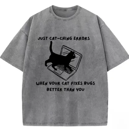 Humorous washed T-shirt featuring "When Your Cat Fixes Bugs Better Than You" design, perfect for cat lovers and tech enthu...
