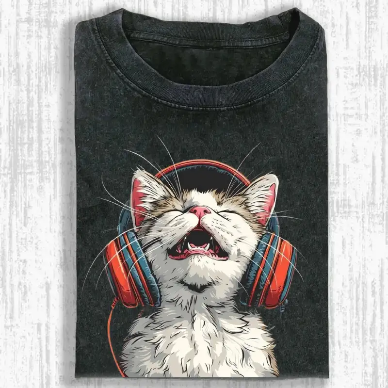 Happy DJ Cat graphic on a stylish washed t-shirt, perfect for cat lovers and music fans.