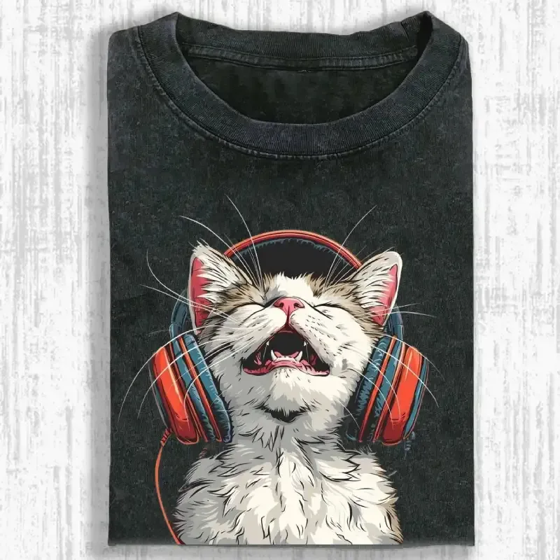 Happy DJ Cat graphic on a stylish washed t-shirt, perfect for cat lovers and music fans.