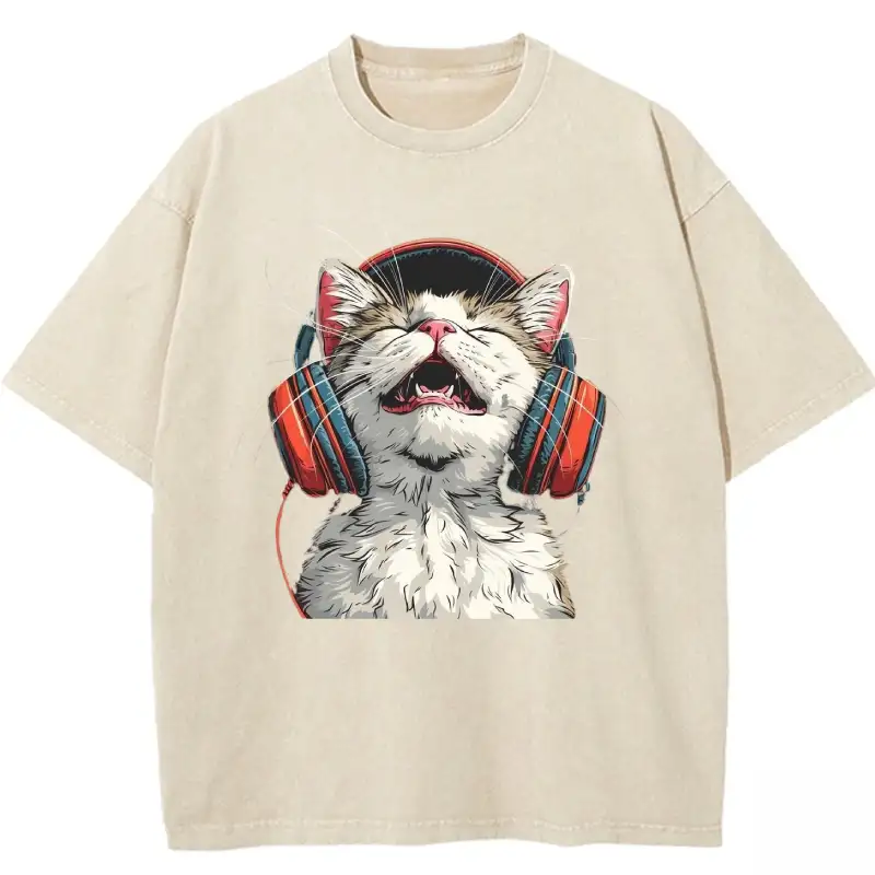 Happy DJ Cat graphic on a trendy washed T-shirt for cat lovers and music enthusiasts. Perfect casual wear!