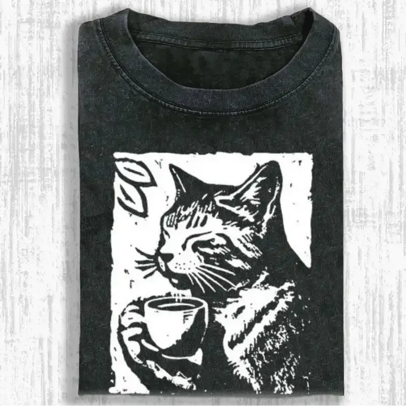 Coffee-drinking cat graphic on a soft, washed T-shirt for cat lovers, perfect for casual wear or gifting.