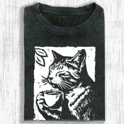 Coffee-drinking cat graphic on a soft, washed T-shirt for cat lovers, perfect for casual wear or gifting.