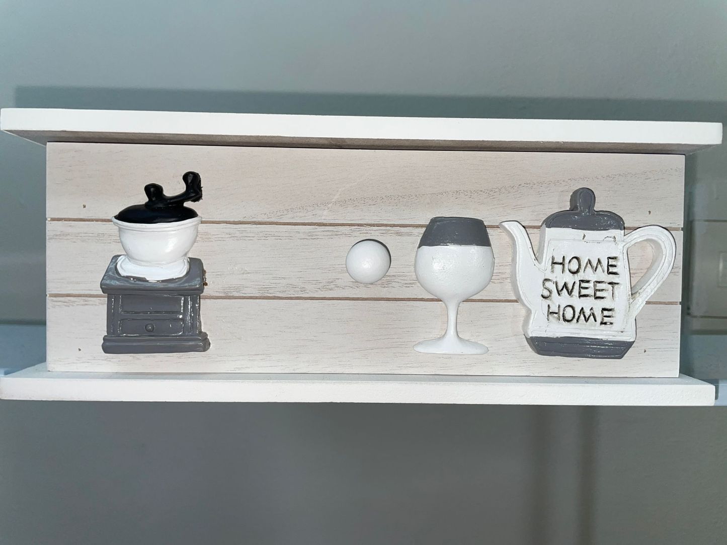 Portacialde di legno con motivo a forma di tazza