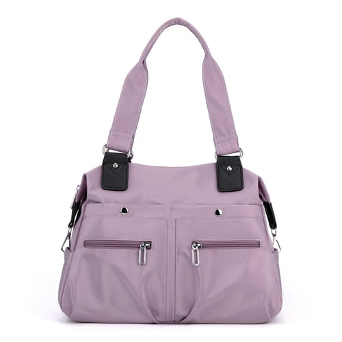 Nagy kapacitású vízálló Multi Pocket válltáska