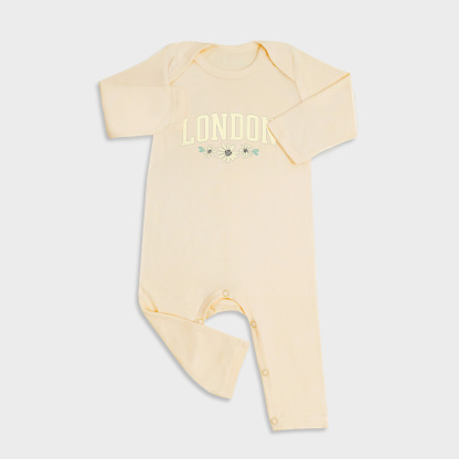 Baby romper featuring London design in Light Yellow