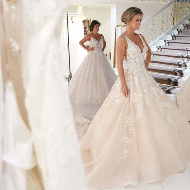 Sexy A-Line Deep V-Neck Spaghetti Strap Floor-Length Backless Wedding Dress with Lace Appliques