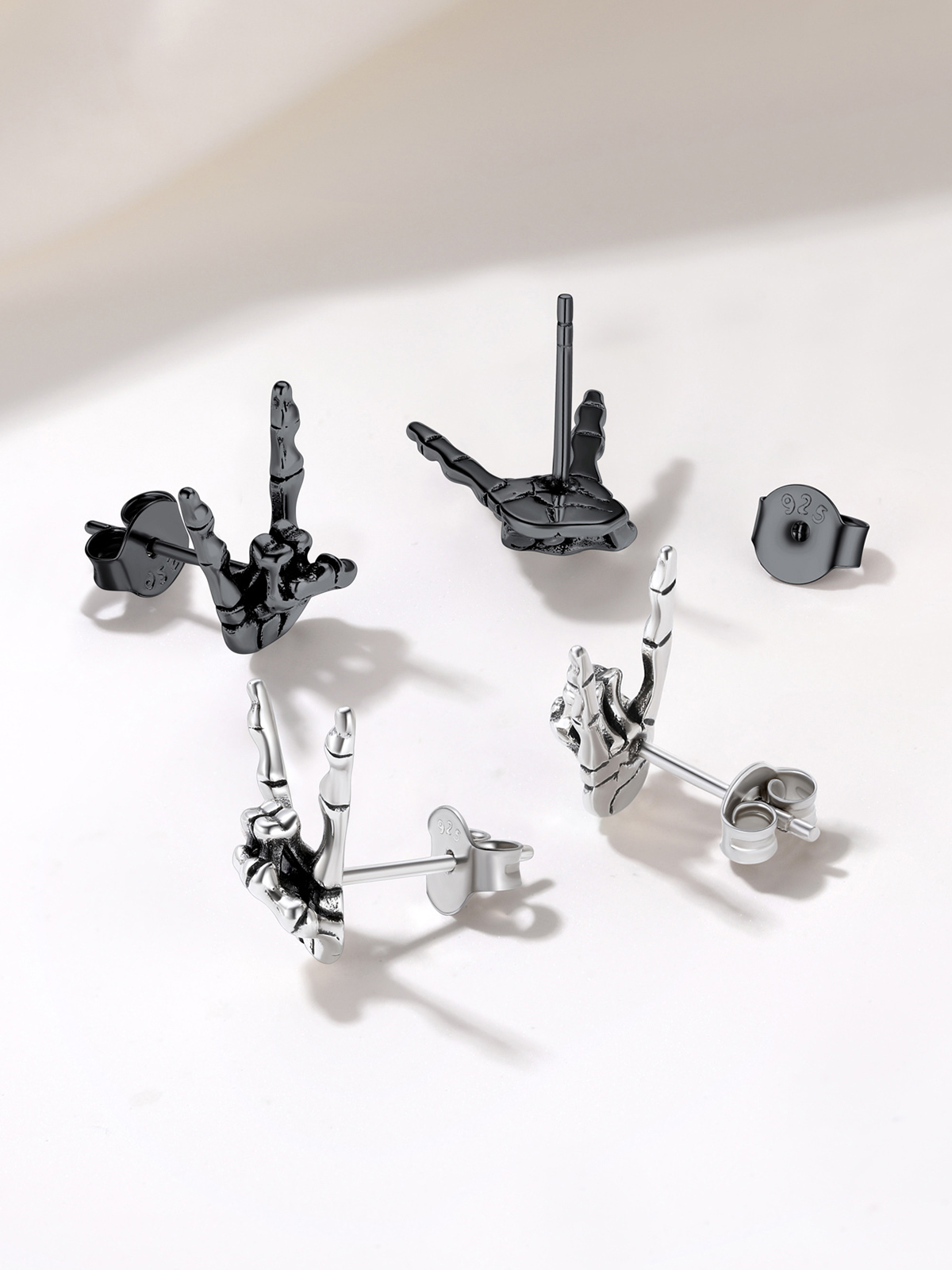 Rock Skull Hand Stud Earrings in Black Plated