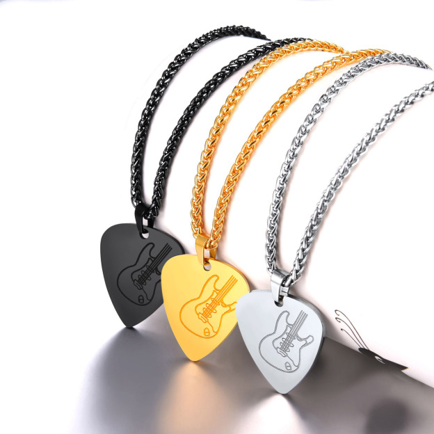 Gold, steel, black guitar pick necklaces displayed together 