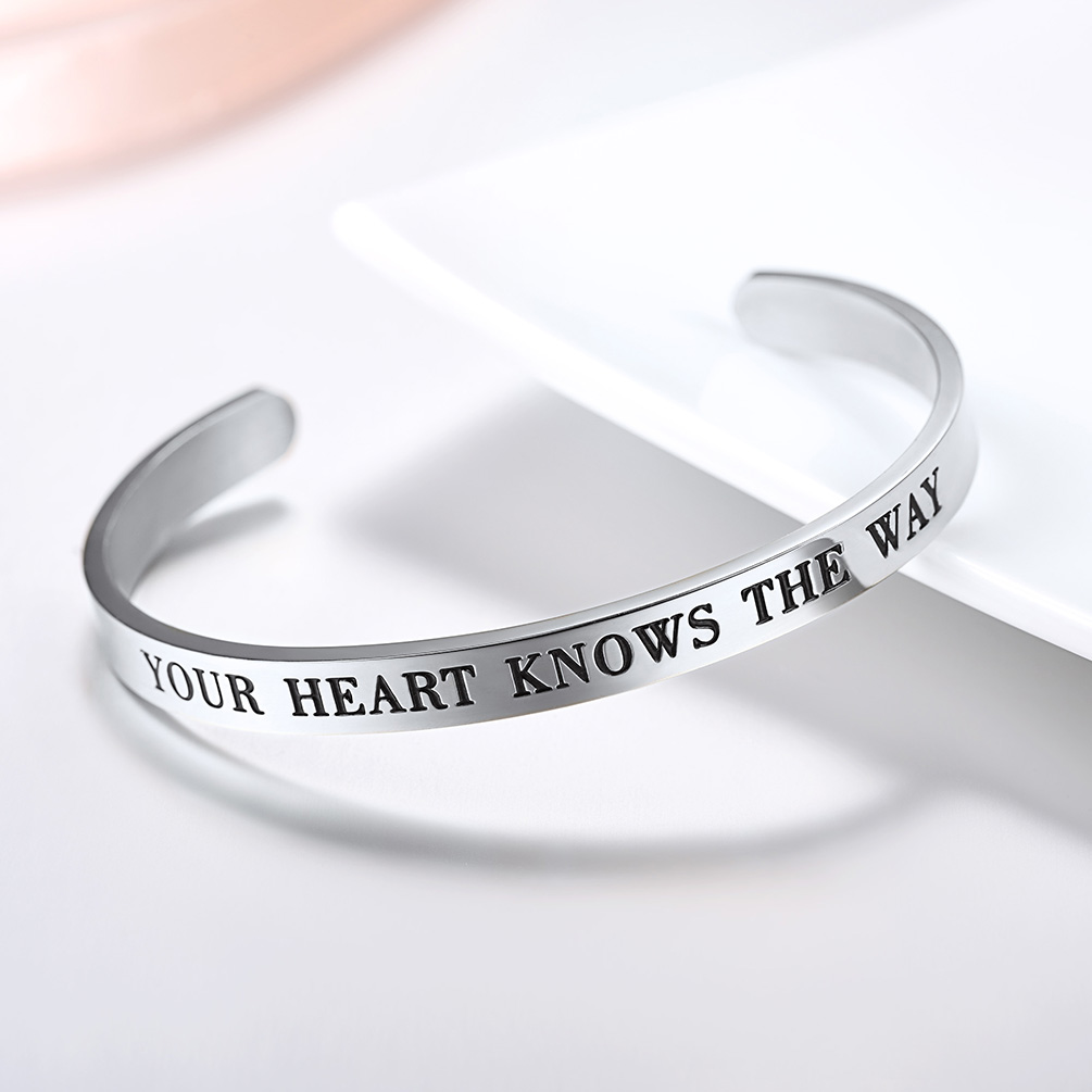 engraved cuff bracelet flat lay