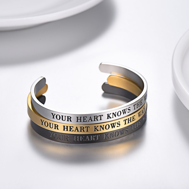 Gold engraved cuff bracelets stacked display